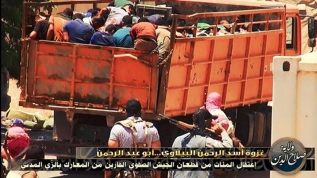 ISIL prisoners are packed into a truck and driven away. Photo: Twitter